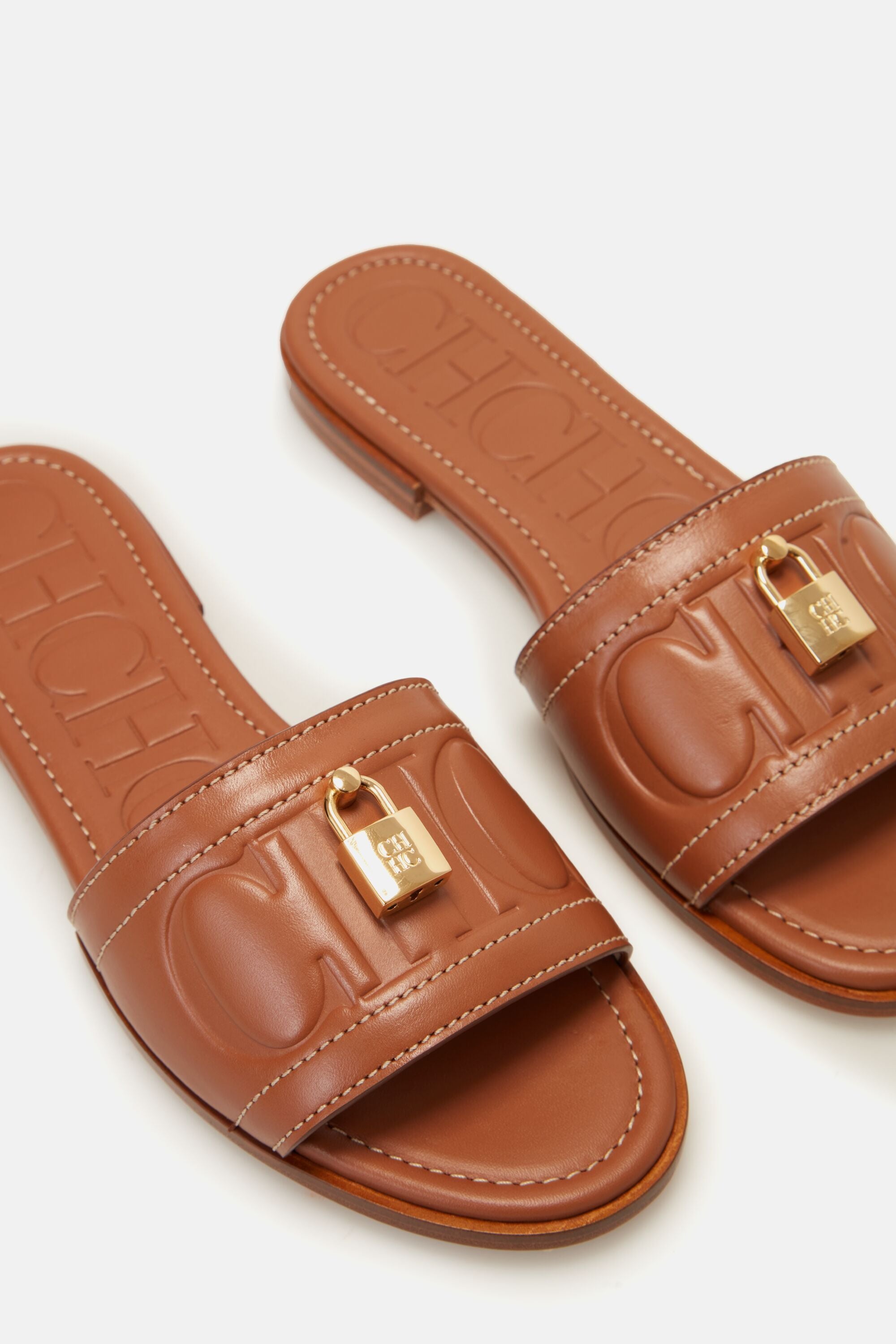 FACTORY LOCKED LEATHER SLIDES cognac - CH Carolina Herrera